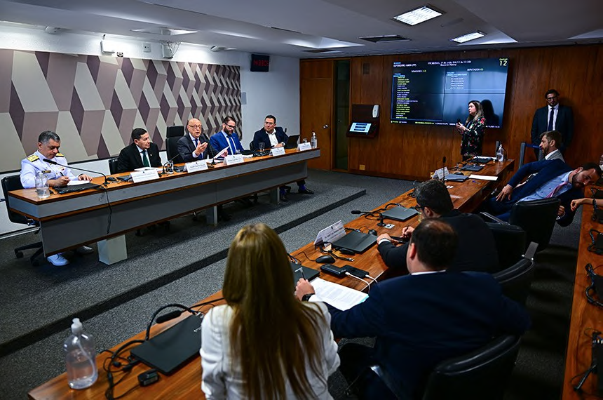 Participants gathered in a Senate committee room.
